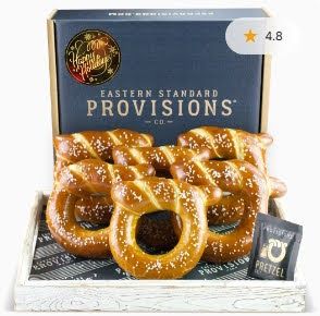 High-quality product image of a pretzel gift box with a 4.8-star rating, representing the type of visual used in e-commerce product feeds and dynamic creative optimization for omnichannel campaigns.